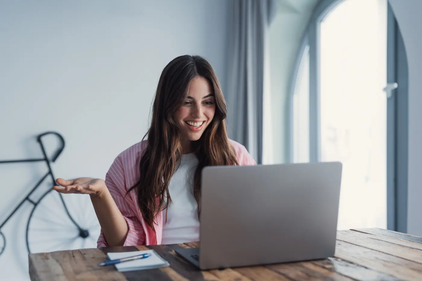 Woman working on a laptop at home