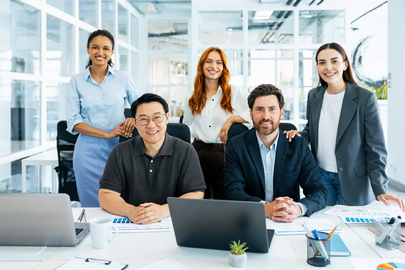 Smiling diverse team in a bright modern office